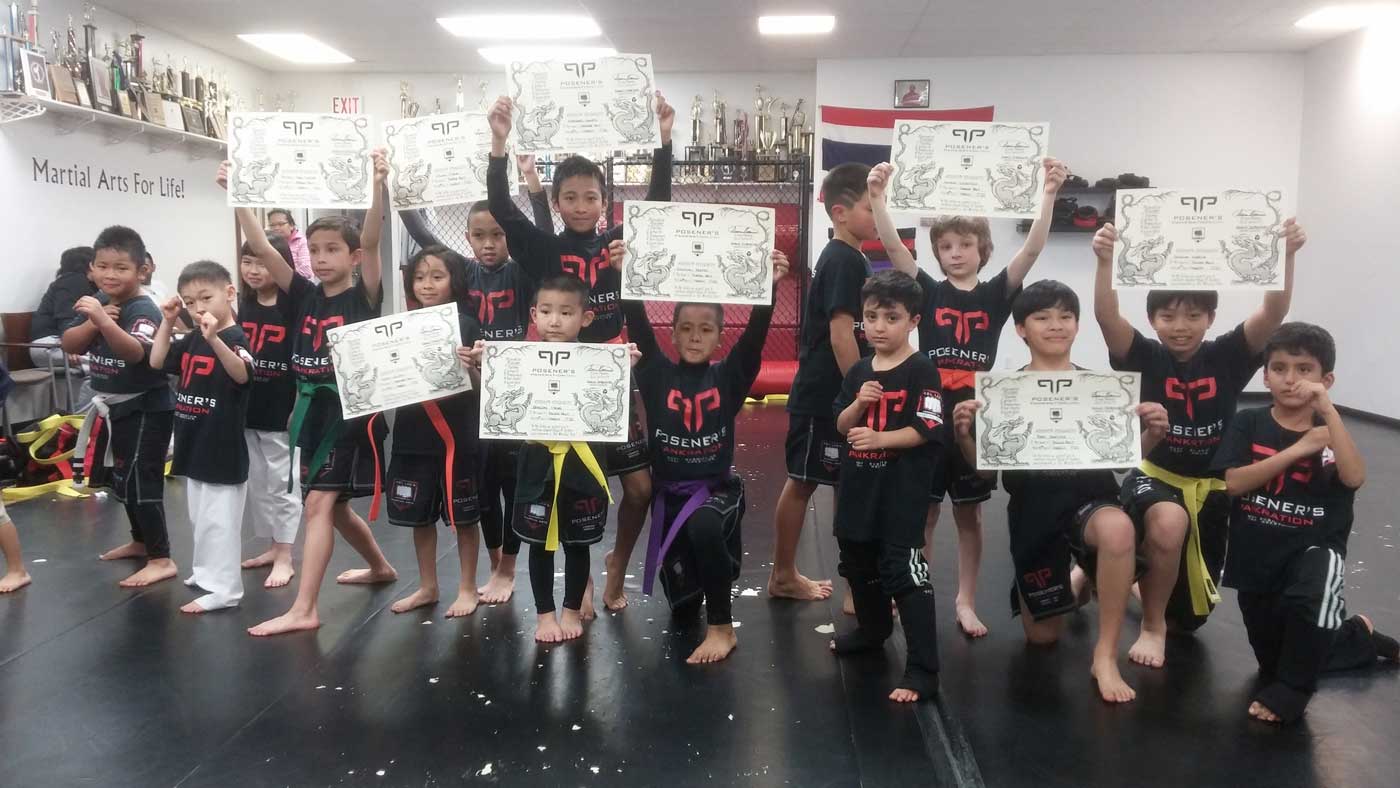 Kids after getting their certificates for martial arts training in Vancouver